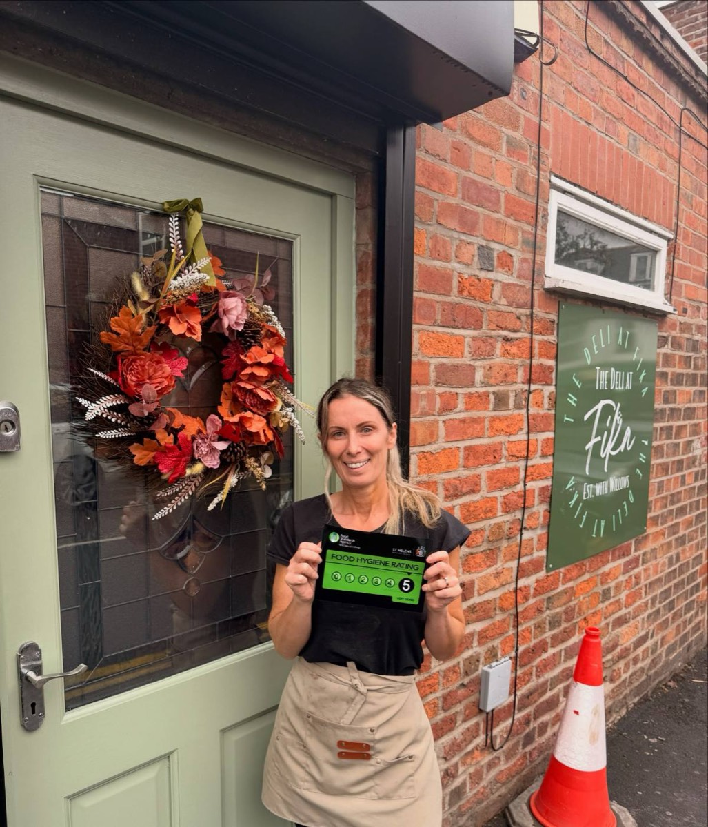 Fika's front door on Walmsley Street with an autumn wreath and the Fika sign