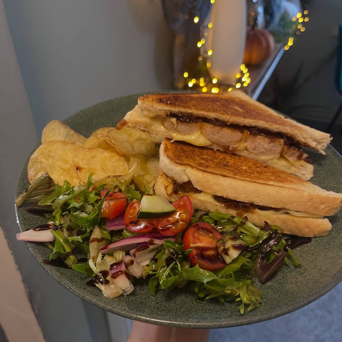 Toasted sandwich with crisps and salad