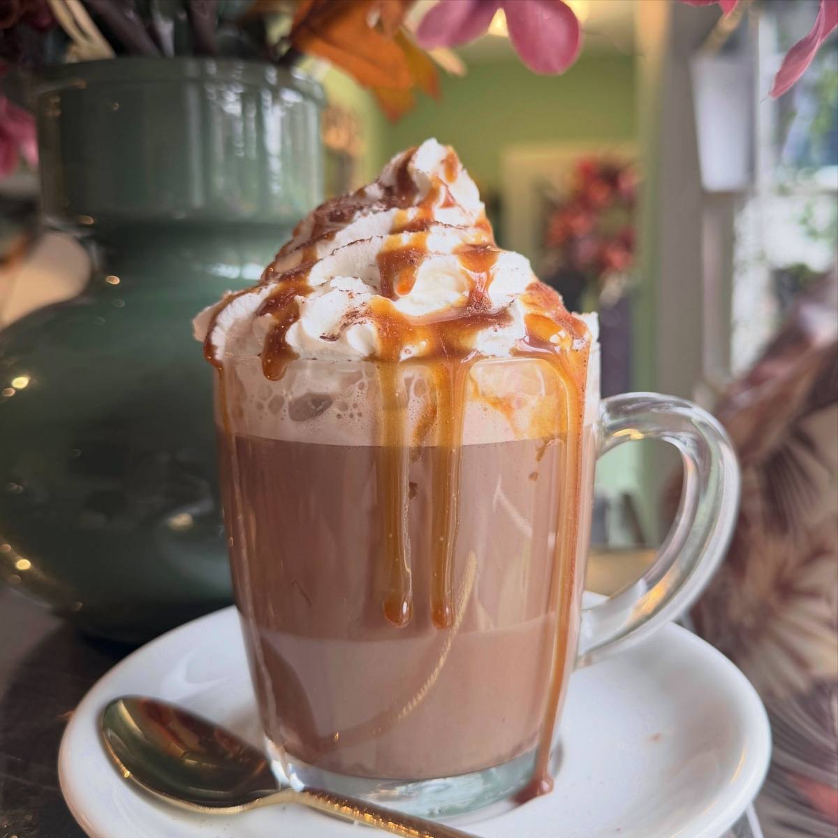 Hot chocolate with cream and caramel drizzle
